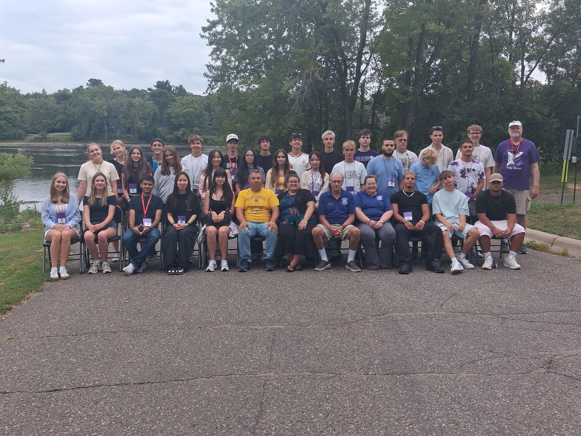 Youth Exchange students and Lions hosts gather along the Mississippi River