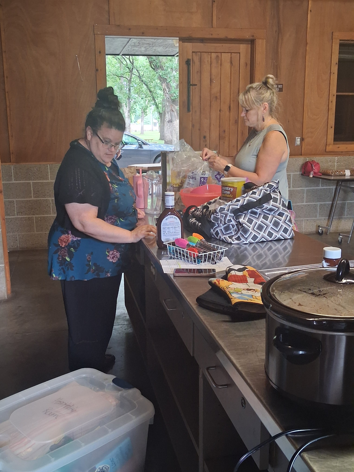 Lions members prepare food for the Youth Exchange picnic