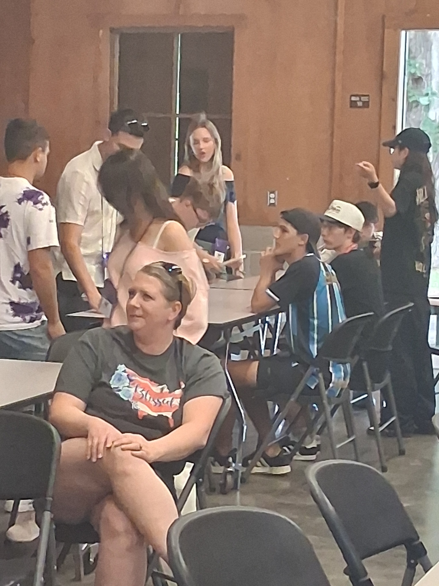 Students and hosts share a meal at the Youth Exchange picnic