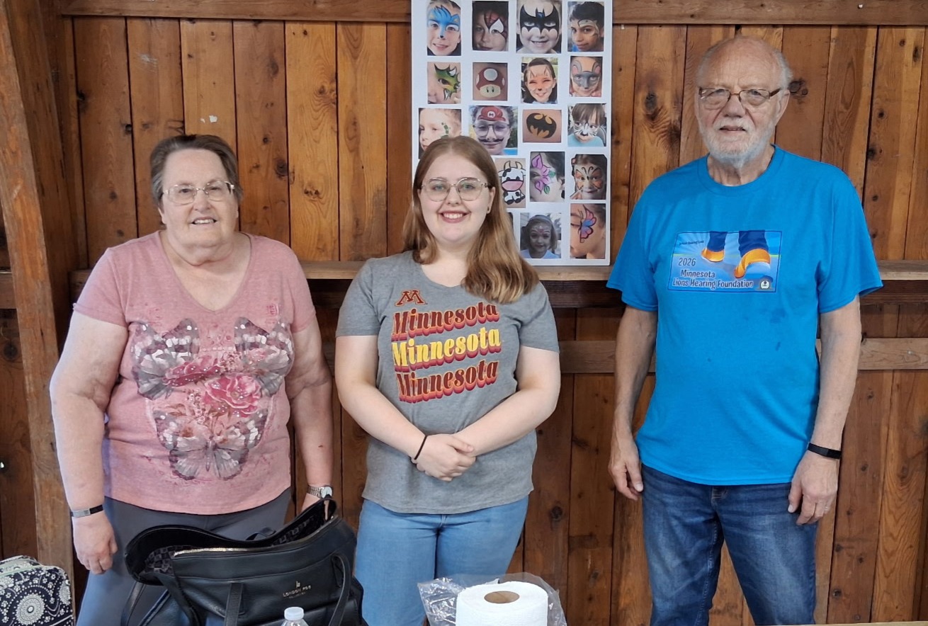 Bob, Debbi, and Grace volunteering at the face-painting booth